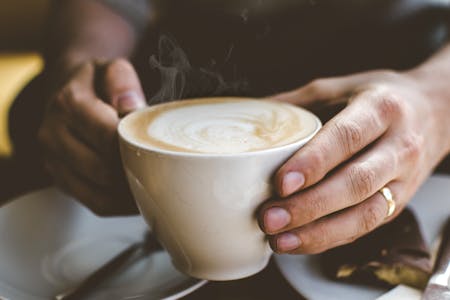 Person holding coffee