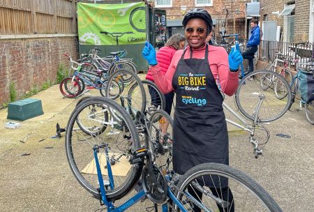 Woman repairing a bike