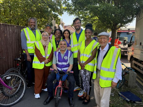 Group of people wearing hivis jackets with Cllr Butt at Revive and Ride event